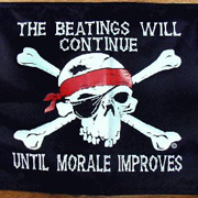 Jolly Roger flag saying: The beatings will continue until morale improves