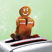 Gingerbread man lowering another gingerbread man into toaster