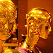 Two golden mannequin-like robots
