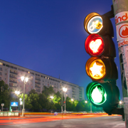 Traffic lights with red heart, amber star, green teardrop